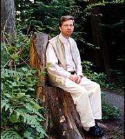 Eckhart Tolle sitting on a tree